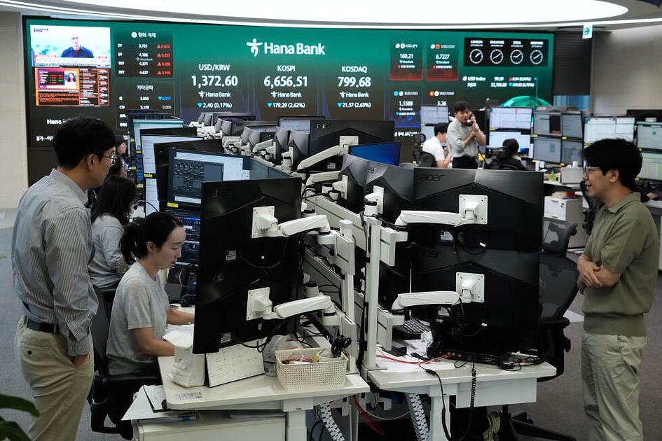 Global stocks fall as bond yields surge and oil prices rise